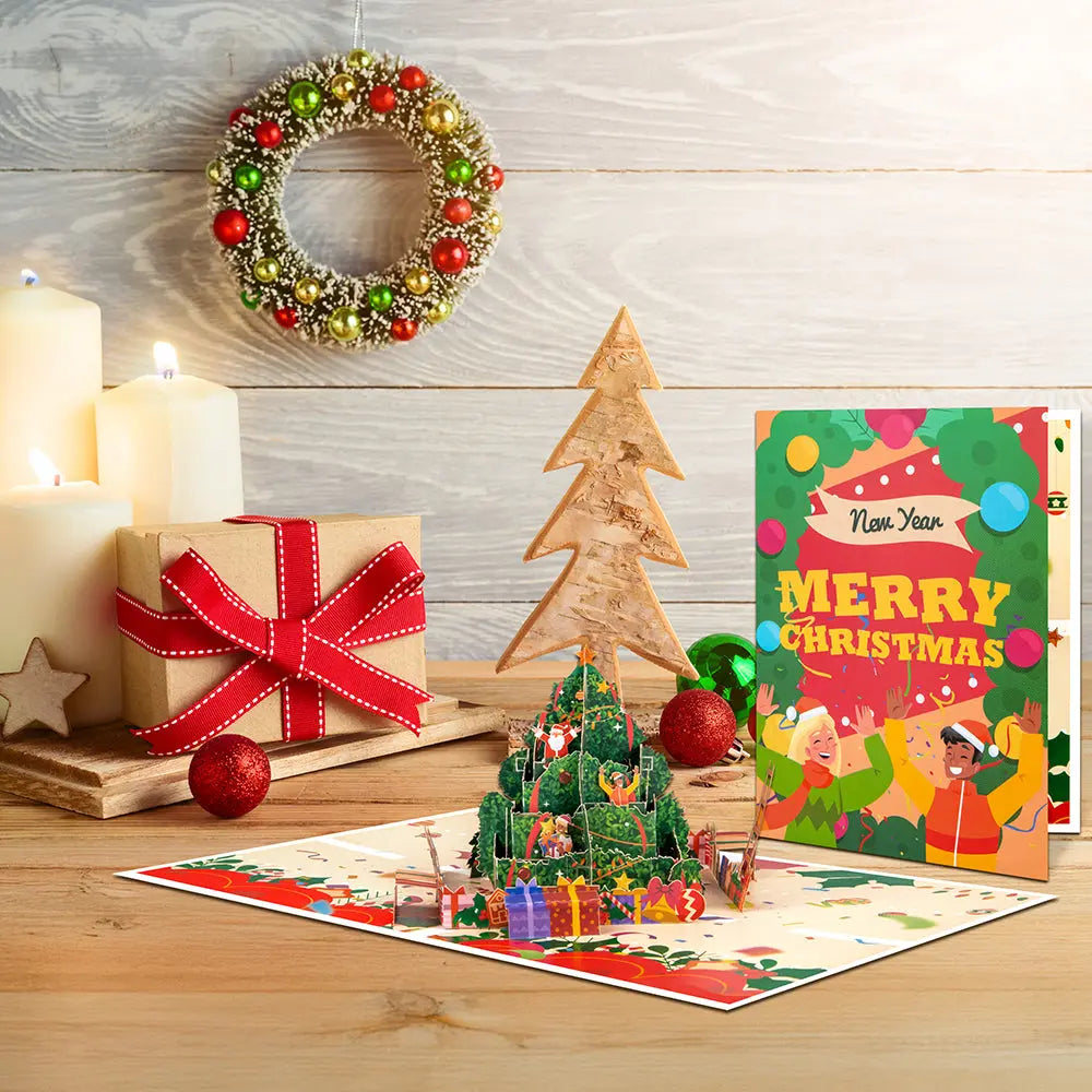 Magic Ants Christmas tree pop-up card displayed with gifts, candles, and a wreath